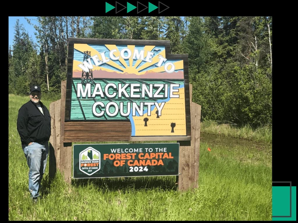 Raye's Signs owners holding FCC 2024 Welcome Sign.