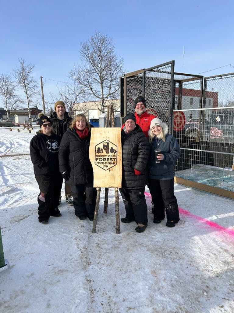 FCC Members Posing Beside The Axe Throwing Section